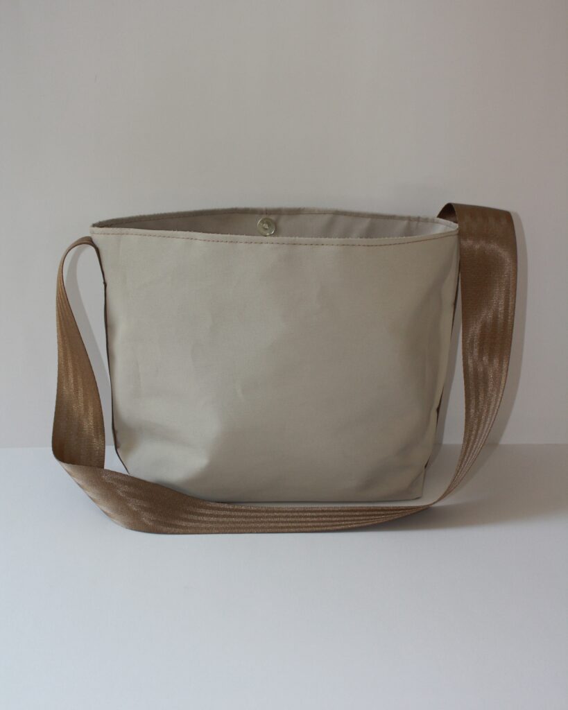 Back View of Beige Kokule Handbag with Strap – Showcasing the Simple and Elegant Design of the Handmade Namibian Bag